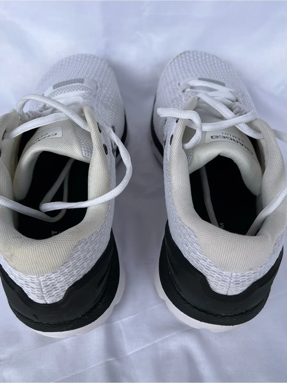 Under Armour (UA Charged Gemini) Mens White and Black Athletic Sneakers